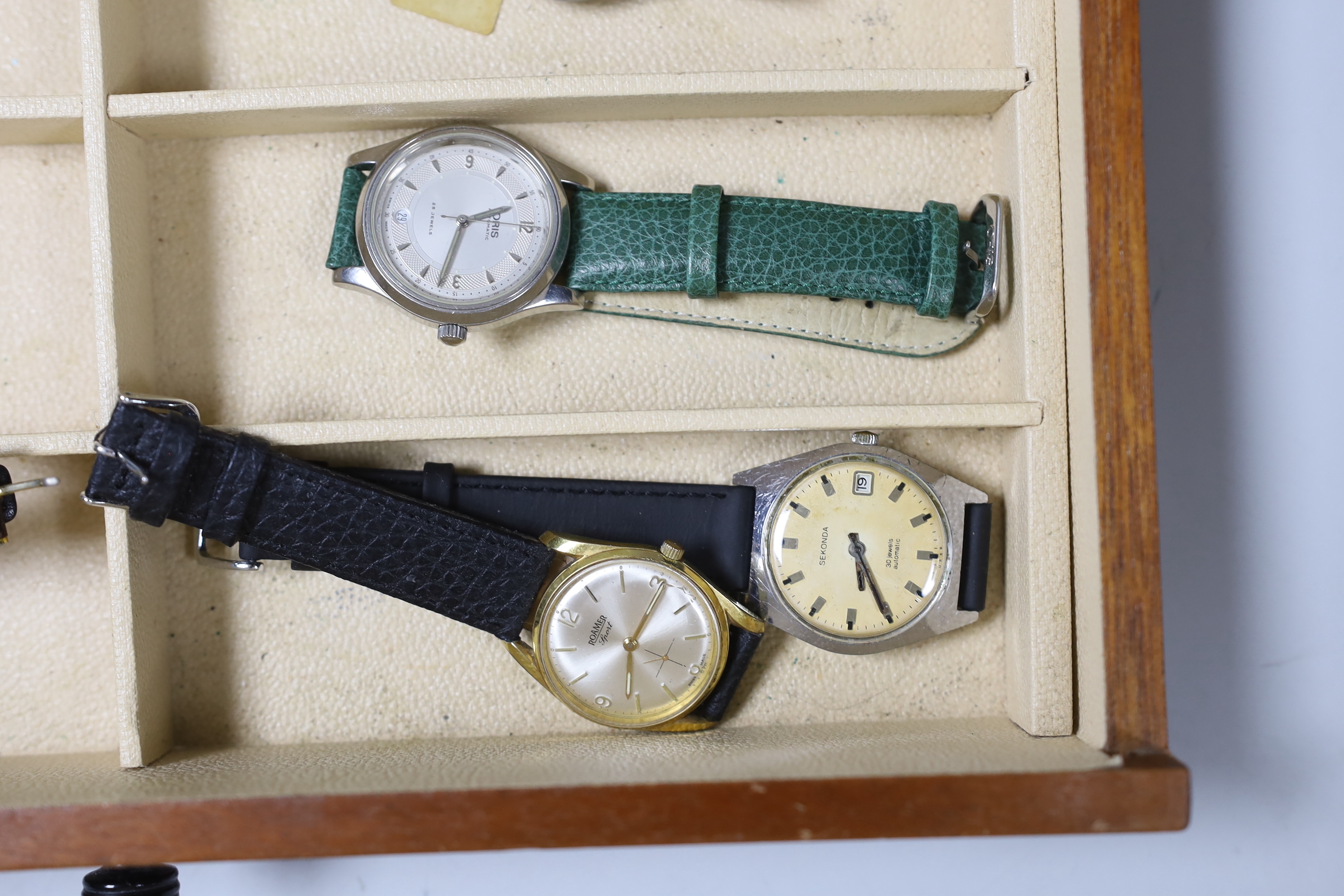 Seventeen assorted lady's or gentleman's wrist watches including a silver manual wind Omega, circa 1917 and a stainless steel Tudor, together with a pedometer?